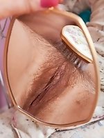 Leona Lee rubs her hairy pussy and big tits